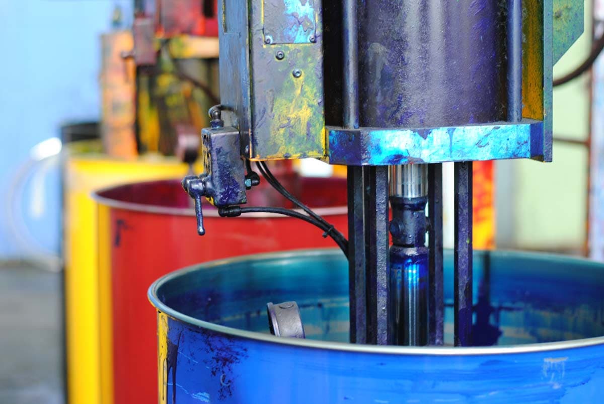 Yellow Red and Blue Print Ink Containers on Press